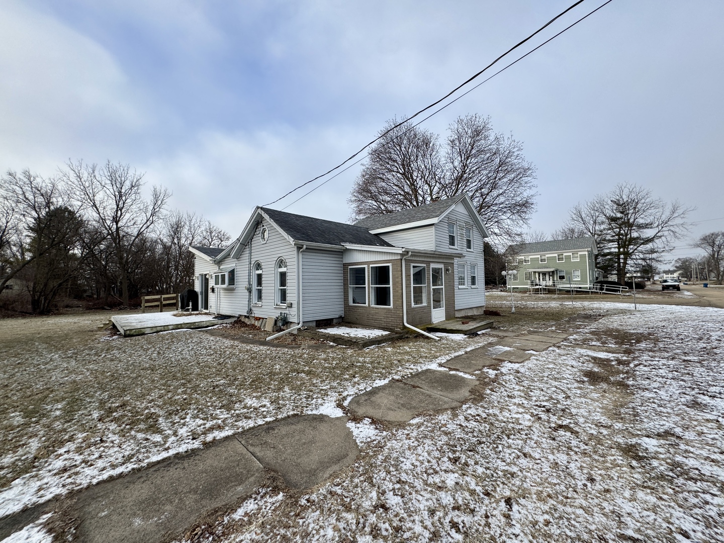 108 West Washington Street Dover, IL 61323 - Photo 3 of 28 a view of a house with a yard