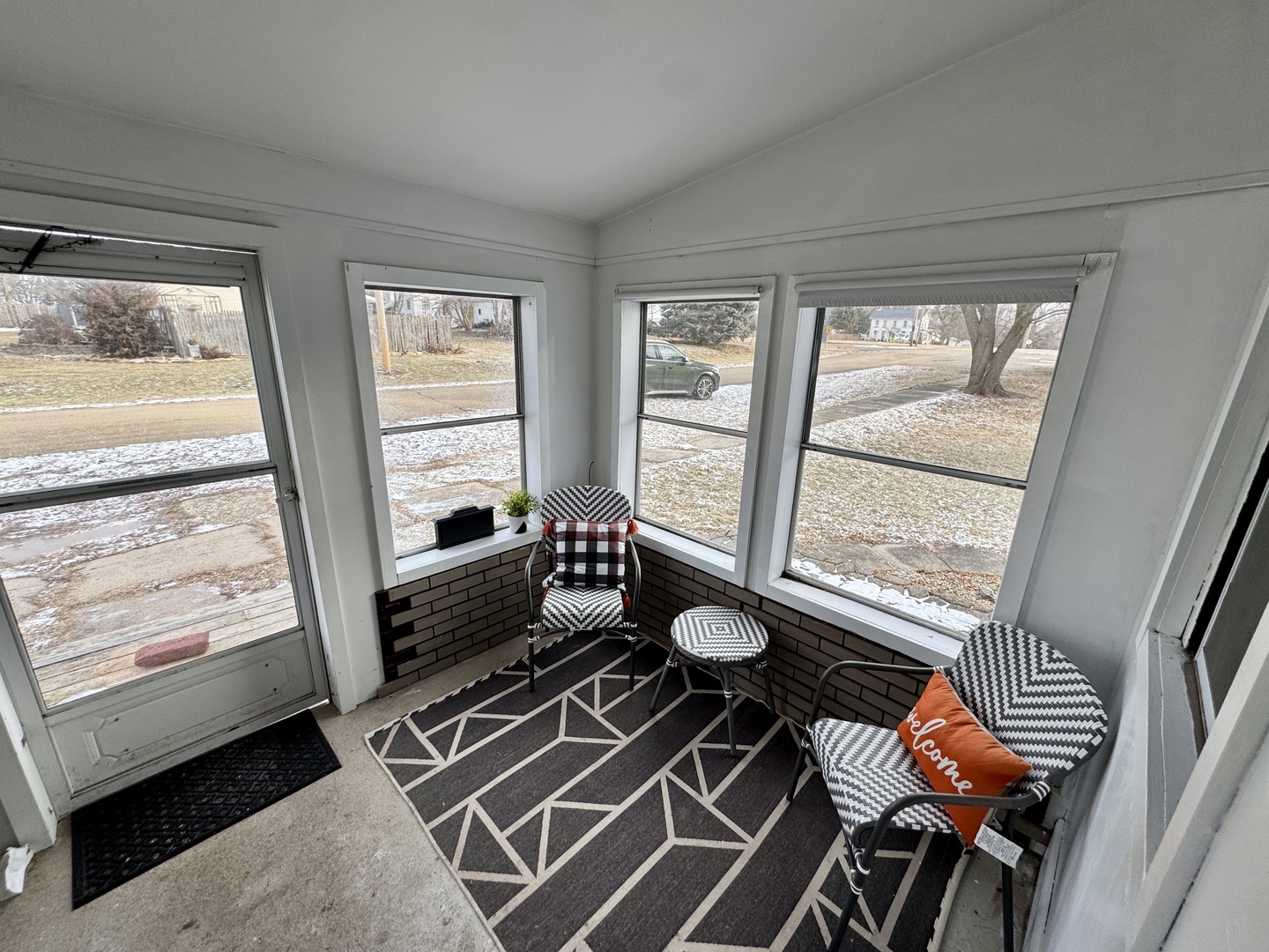 108 West Washington Street Dover, IL 61323 - Photo 5 of 28 a living room with furniture and a floor to ceiling window