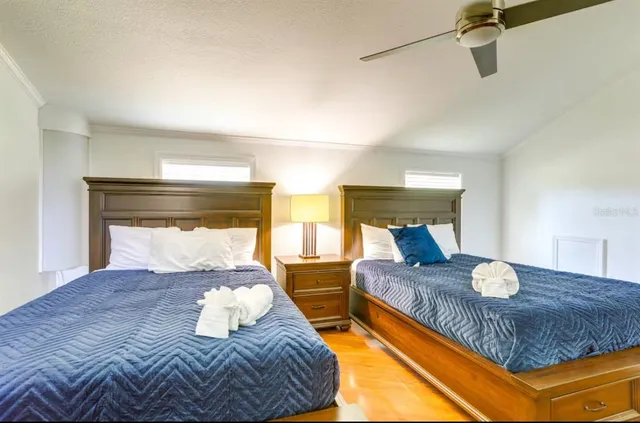 a bedroom with a large bed and a window