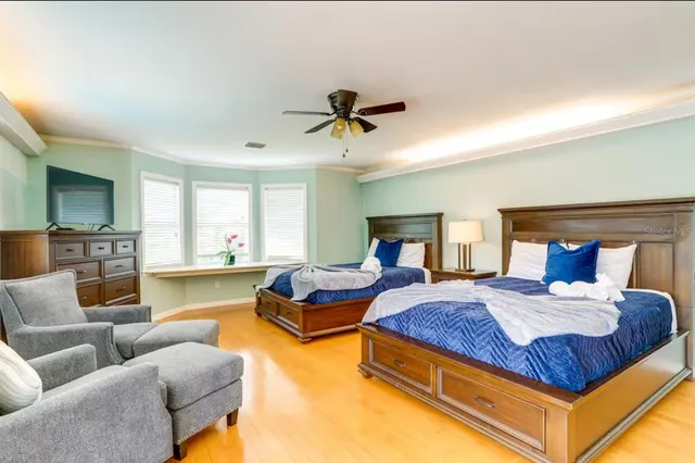 a bedroom with bed and a couch