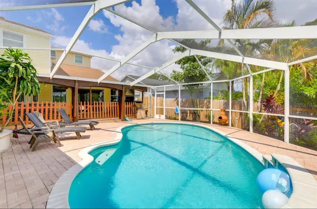 a view of a swimming pool with a lounge chairs