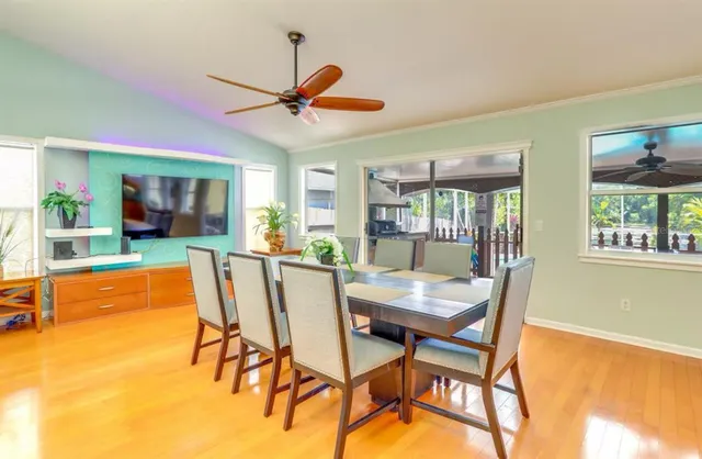 a dining room with furniture and window