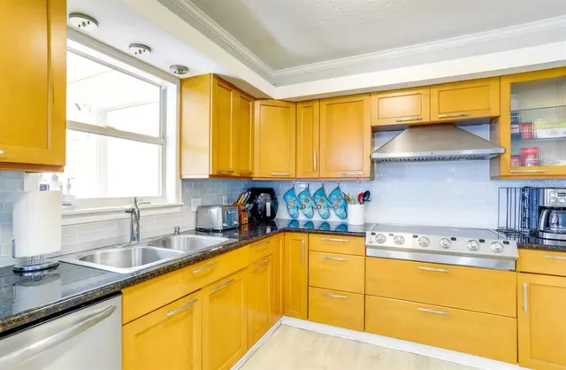 a kitchen with a sink and a window