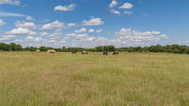a view of a field with an outdoor space