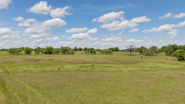 a view of a big building with big yard