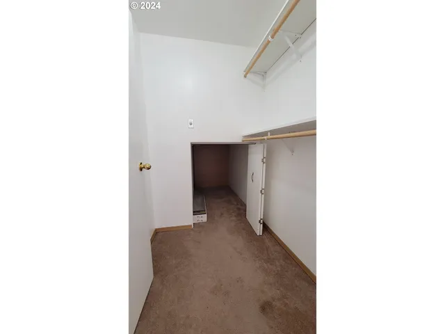 a open hall with a cabinet