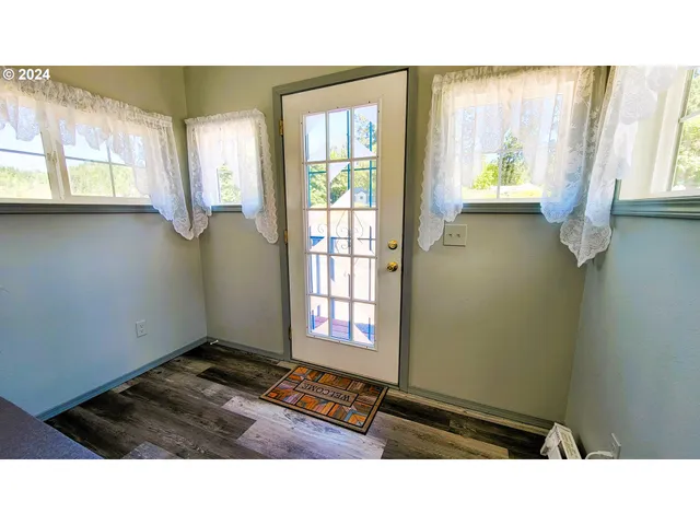 a kitchen with a table and chairs in it