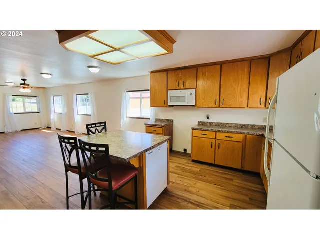 a bathroom with a sink a mirror and a bath tub
