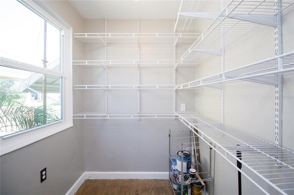 2512 West Cordelia Street Tampa, FL 33607 - Photo 15 of 19 a view of storage and utility room with racks on the wall