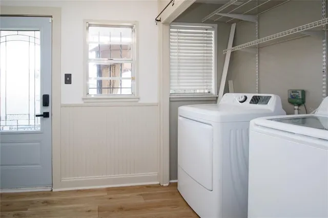 a view of storage and utility room with washer and dryer