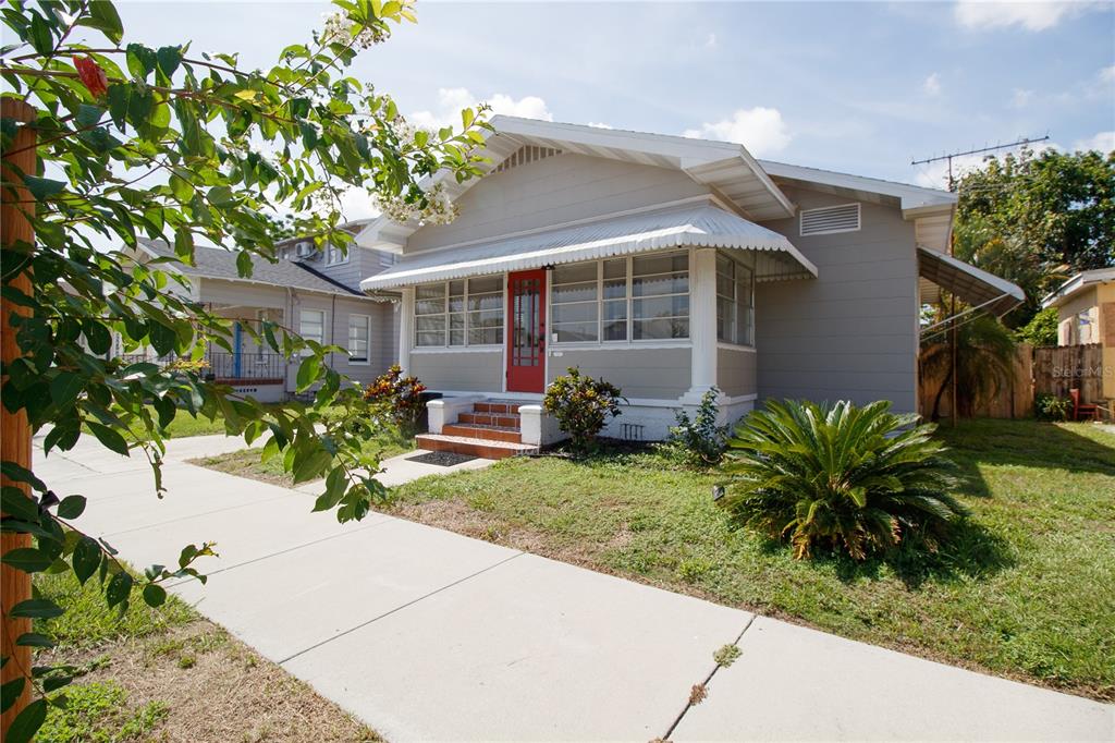 2512 West Cordelia Street Tampa, FL 33607 - Photo 3 of 19 a view of a house with a yard and sitting area