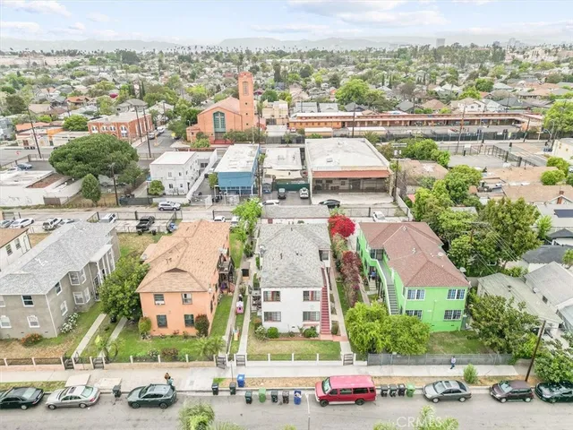 an aerial view of residential houses with outdoor space