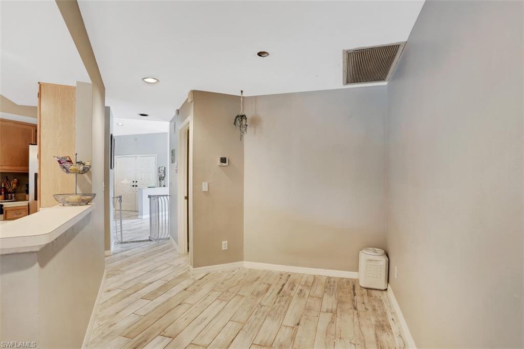 7359 Stonegate Drive Naples, FL 34109 - Photo 11 of 33 a view of bathroom with a sink a toilet and a bathtub
