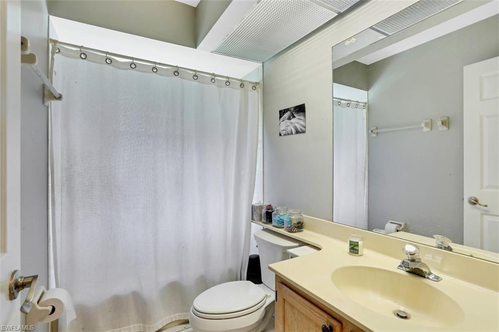 7359 Stonegate Drive Naples, FL 34109 - Photo 20 of 33 a bathroom with a sink toilet and shower