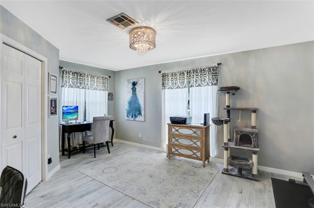 7359 Stonegate Drive Naples, FL 34109 - Photo 22 of 33 a view of a workspace with workspace and a window