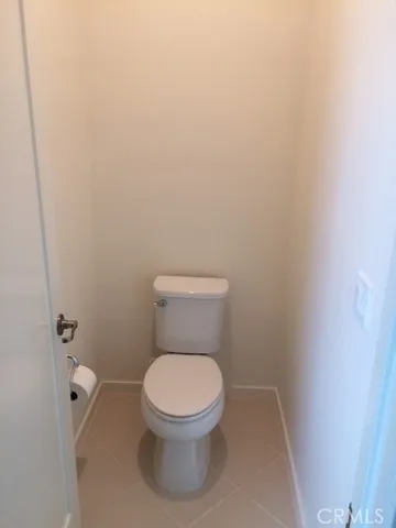 a white toilet sitting in a bathroom