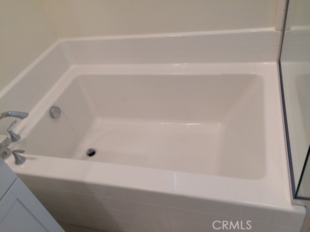 1613 East Lincoln Avenue Anaheim, CA 92805 - Photo 18 of 26 a bathroom with a bathtub