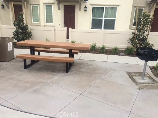 a bench is sitting in front of a house