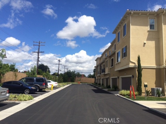 1613 East Lincoln Avenue Anaheim, CA 92805 - Photo 3 of 26 a view of a street with cars