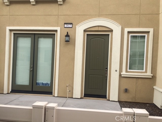 1613 East Lincoln Avenue Anaheim, CA 92805 - Photo 7 of 26 a view of entrance door of a house