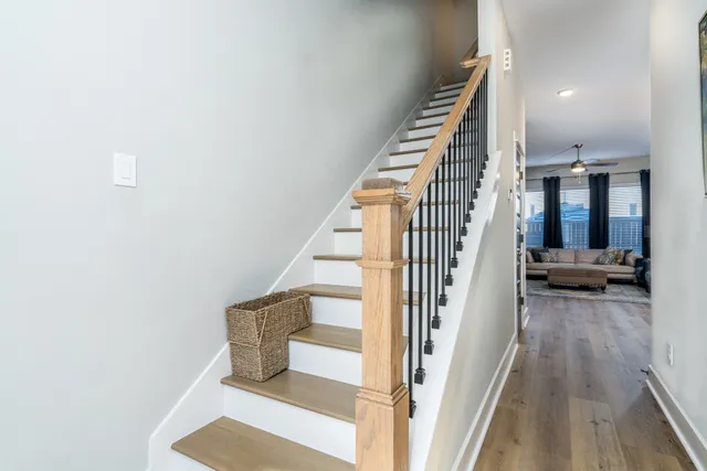 a view of entryway and hall with wooden floor