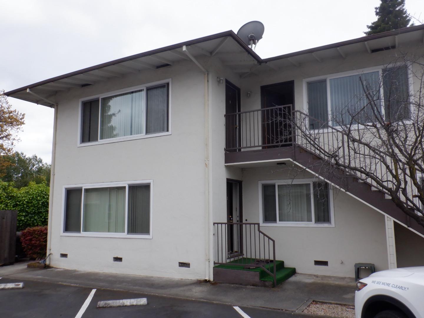 a view of a house with a parking space