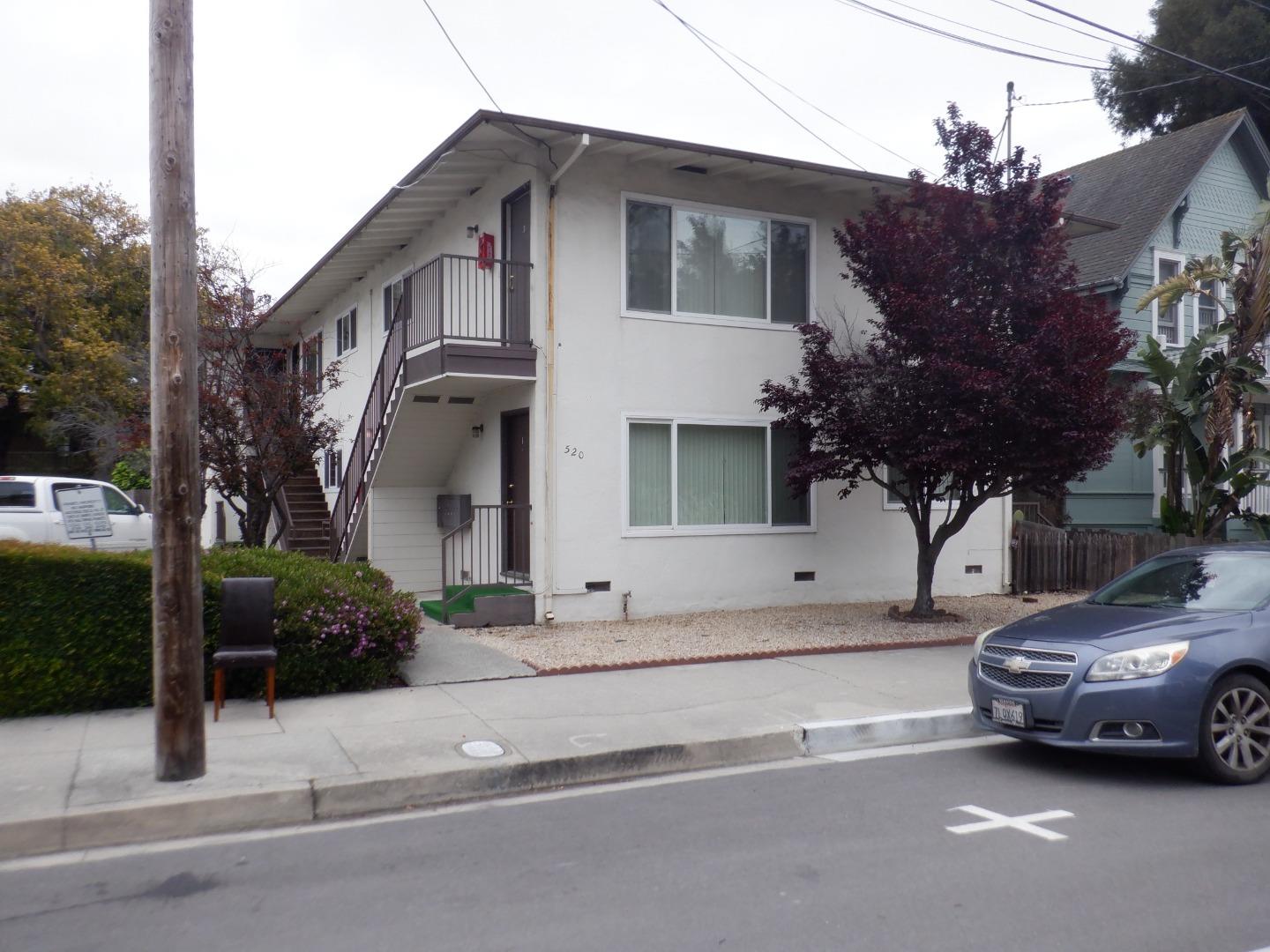 520 Chestnut Street Santa Cruz, CA 95060 - Photo 2 of 14 a car parked in front of a white house