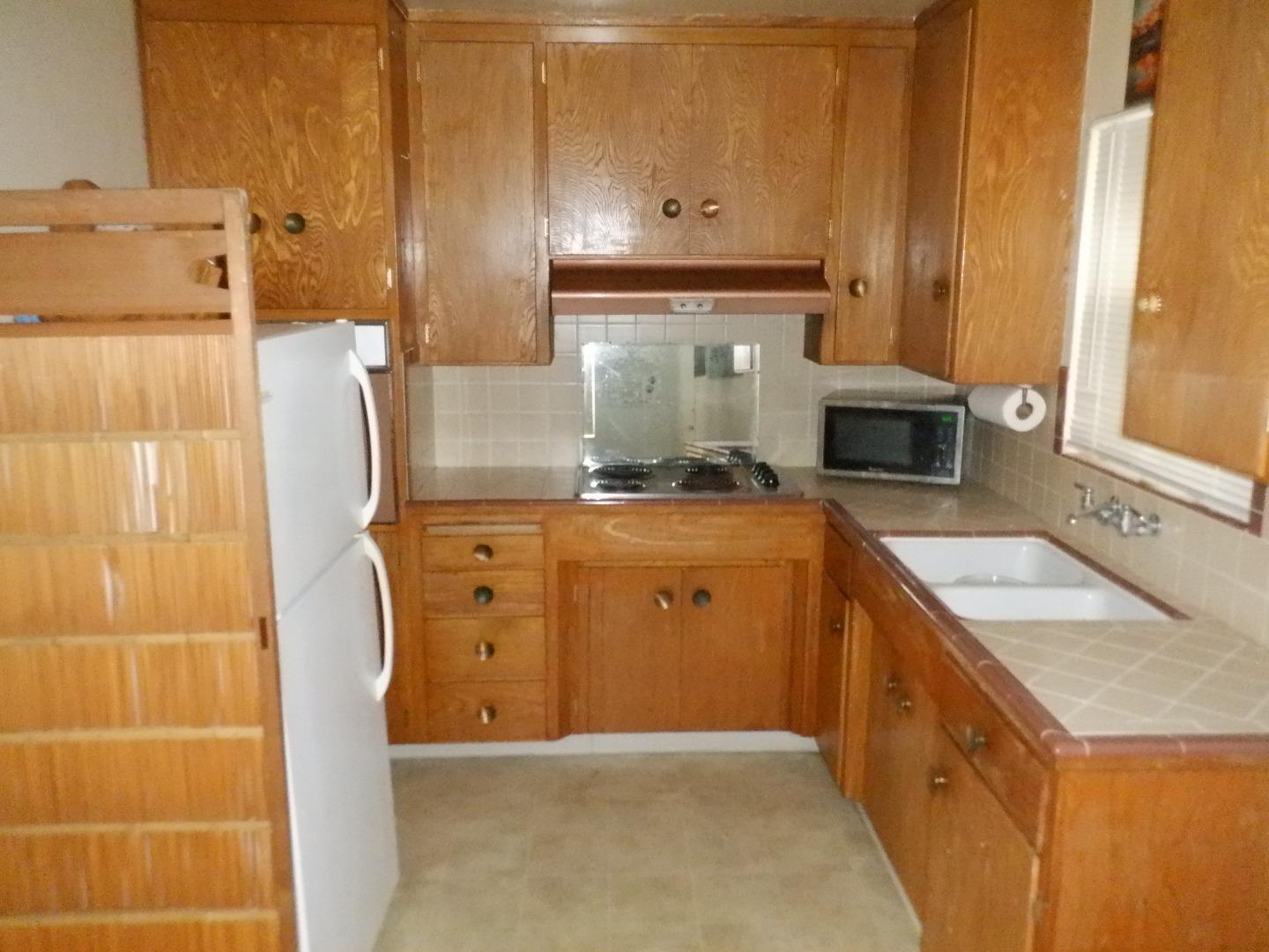 520 Chestnut Street Santa Cruz, CA 95060 - Photo 10 of 14 a kitchen with a stove and a refrigerator