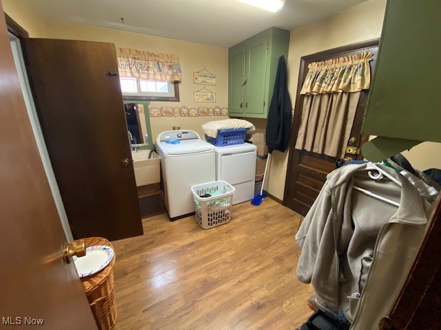 183 Trails End Road Toronto, OH 43964 - Photo 20 of 25 Laundry room with separate washer and dryer, cabinets, and light hardwood / wood-style floors