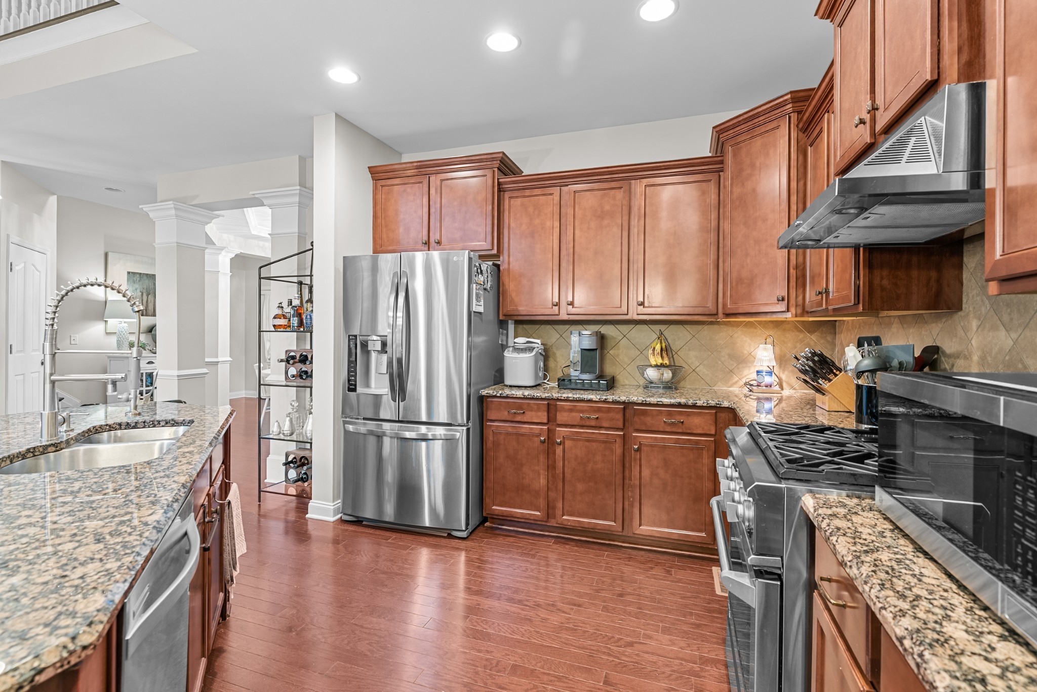 413 Marlowe Court Nolensville, TN 37135 - Photo 12 of 37 a kitchen with stainless steel appliances granite countertop a refrigerator stove and sink