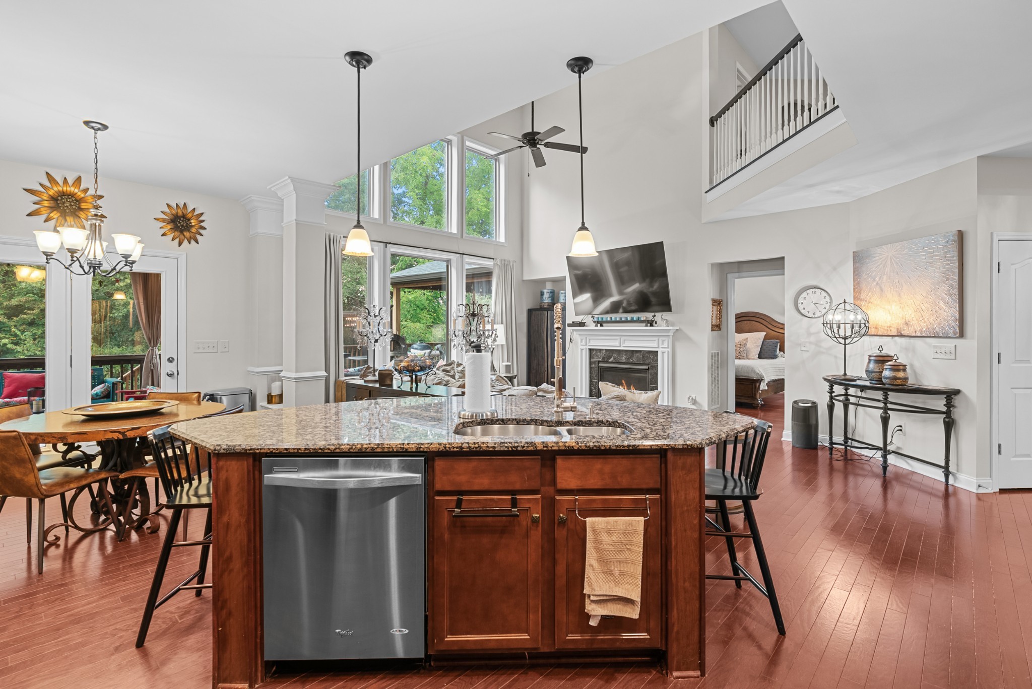 413 Marlowe Court Nolensville, TN 37135 - Photo 14 of 37 a kitchen with kitchen island granite countertop wooden floor and white cabinets