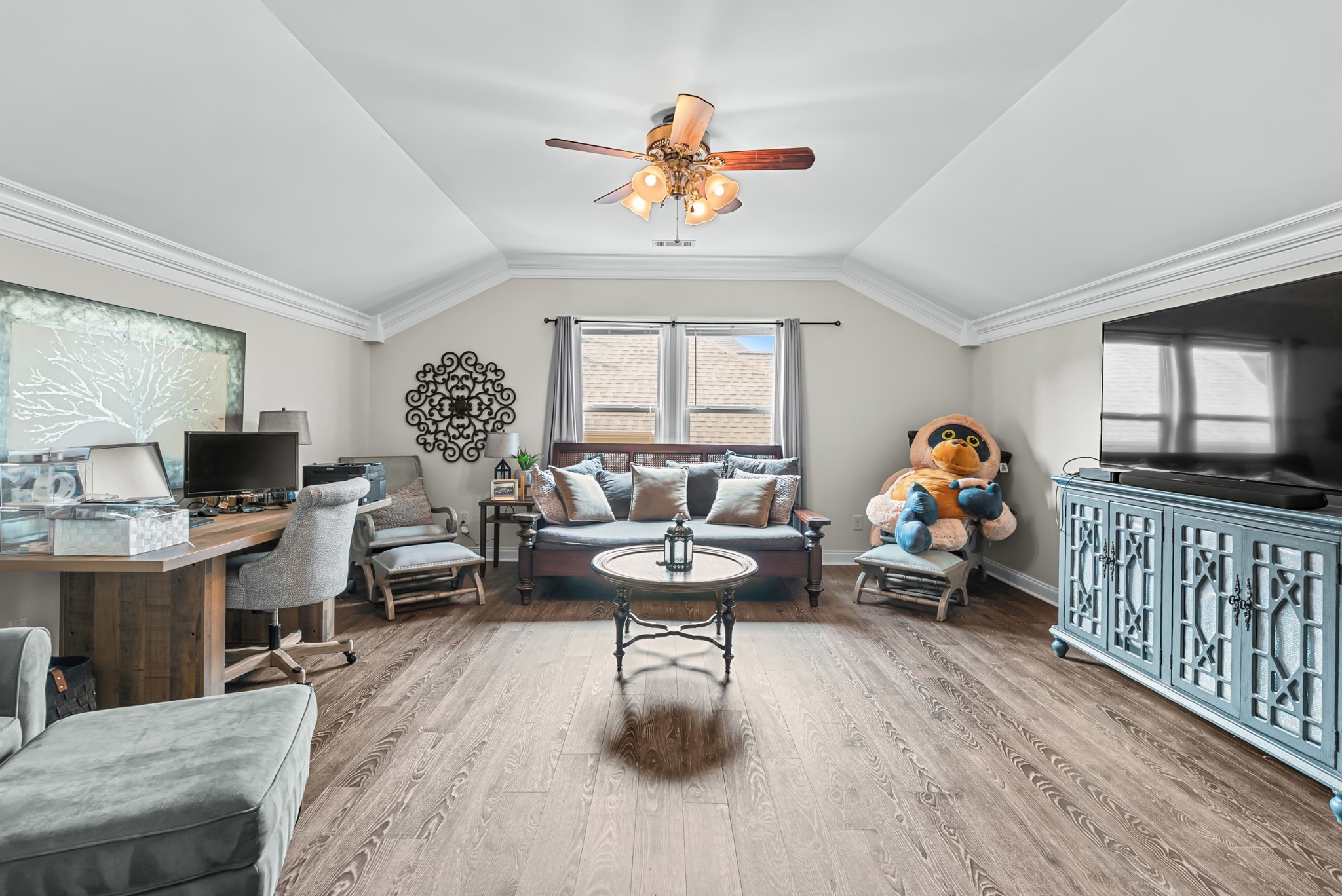 413 Marlowe Court Nolensville, TN 37135 - Photo 16 of 37 a living room with furniture a window and a flat screen tv