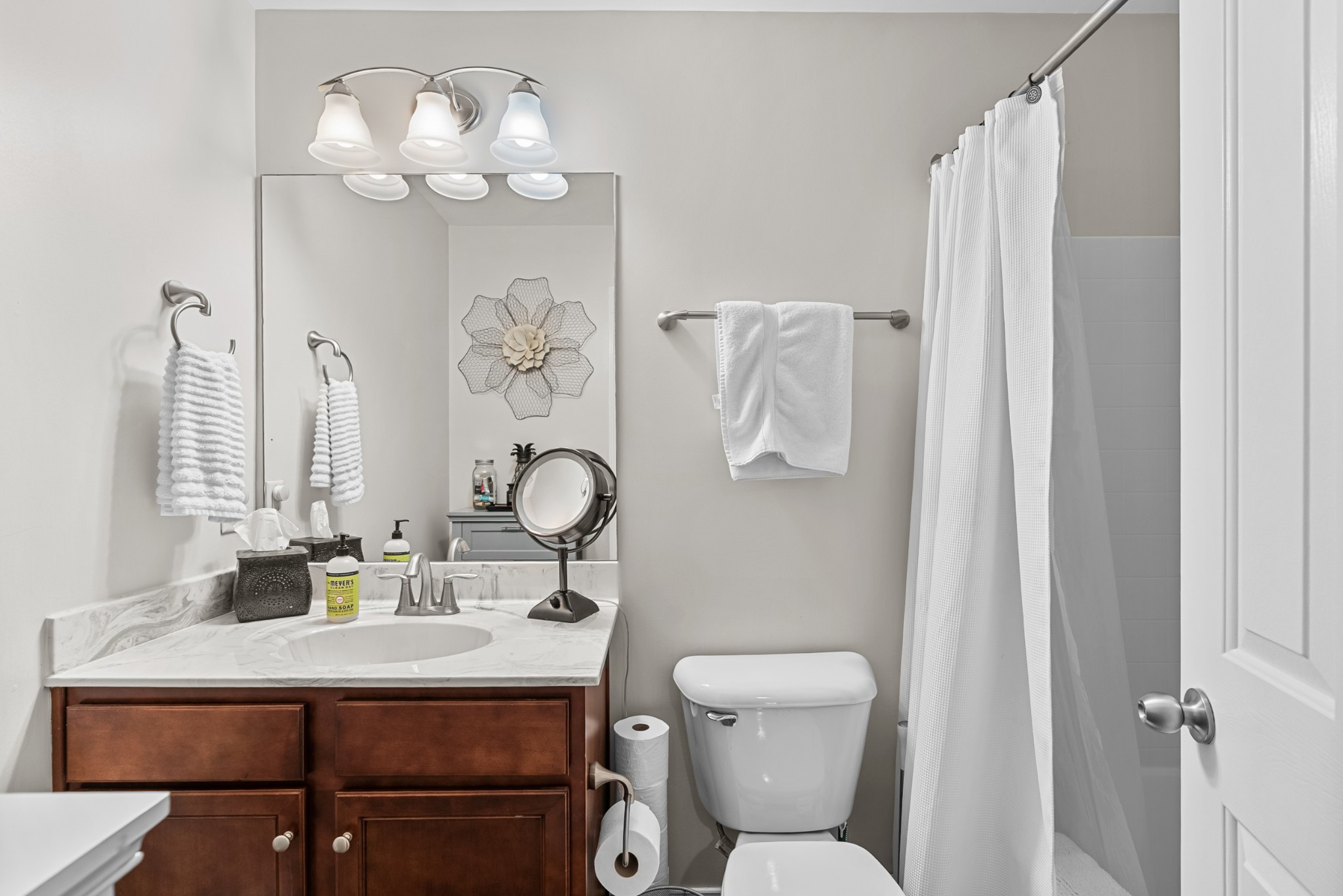 413 Marlowe Court Nolensville, TN 37135 - Photo 24 of 37 a bathroom with a sink a toilet and a mirror