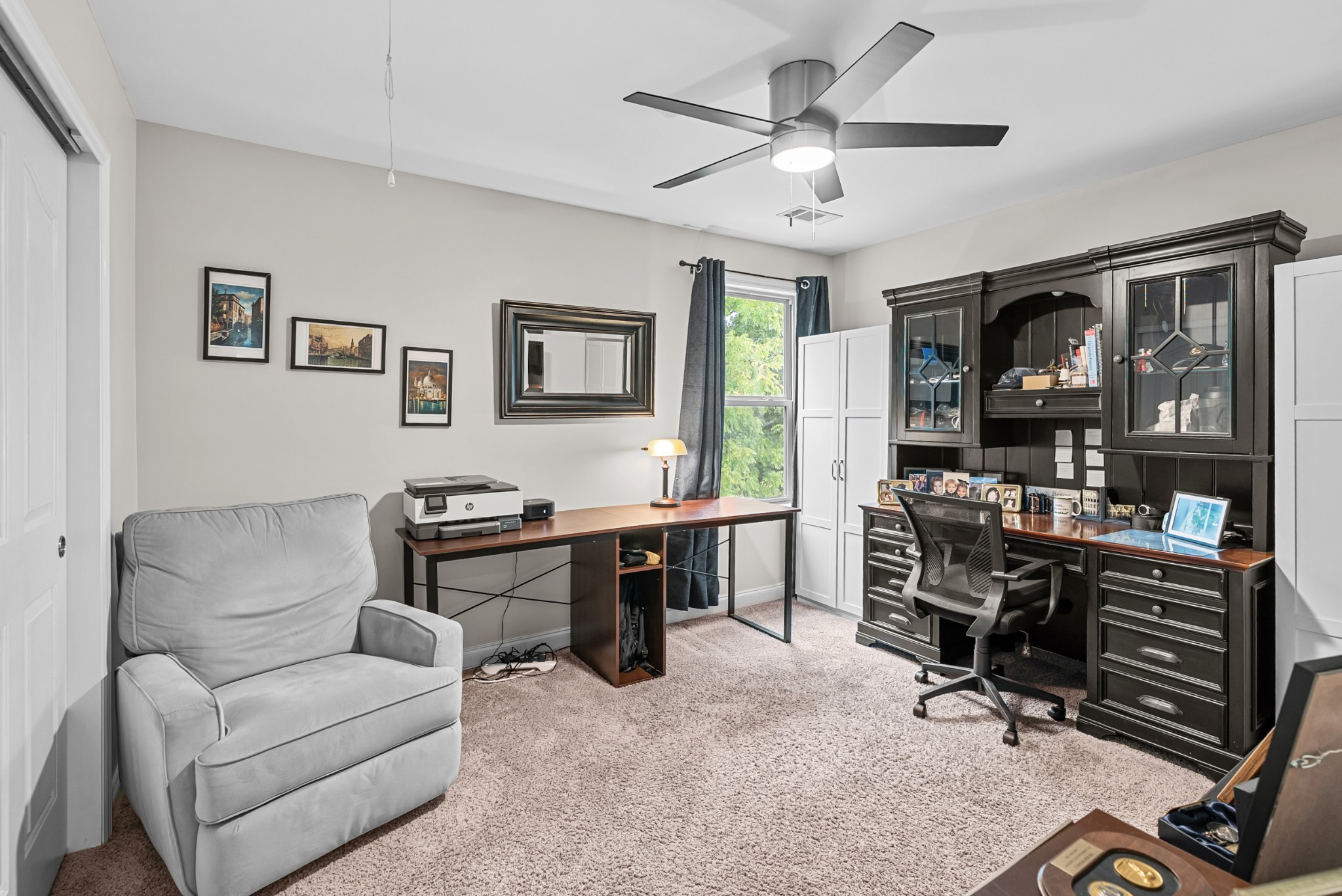 413 Marlowe Court Nolensville, TN 37135 - Photo 26 of 37 a living room with furniture a desk and a flat screen tv