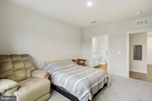 a bedroom with two beds and painted walls