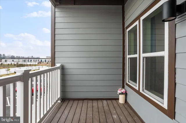 a view of a balcony with wooden floor