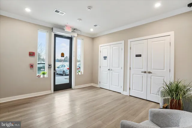 a view of an empty room with glass door