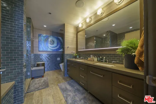 a bathroom with a bathtub and shower