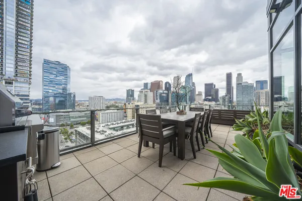 a view of a terrace with sitting area
