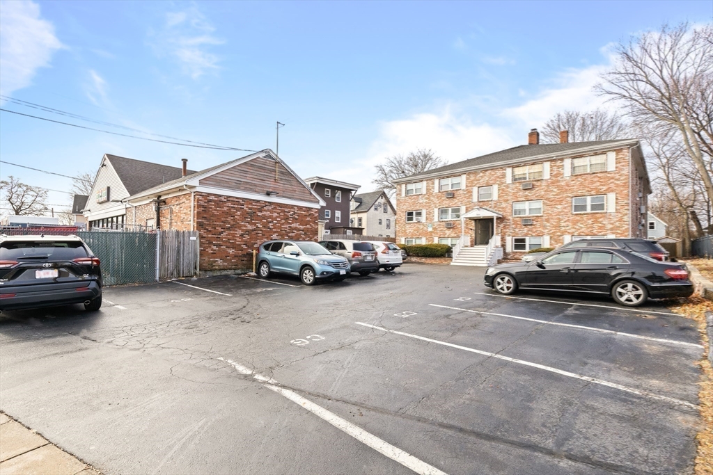 303 Broadway, Unit C2 Lynn, MA 01904 - Photo 15 of 15 a car parked in front of a house
