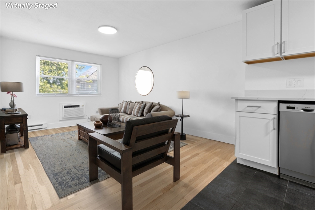 303 Broadway, Unit C2 Lynn, MA 01904 - Photo 3 of 15 a living room with furniture