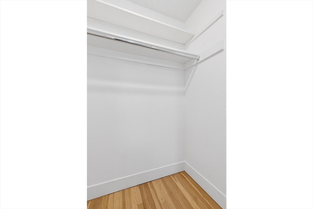 303 Broadway, Unit C2 Lynn, MA 01904 - Photo 9 of 15 a view of a room with wooden floor