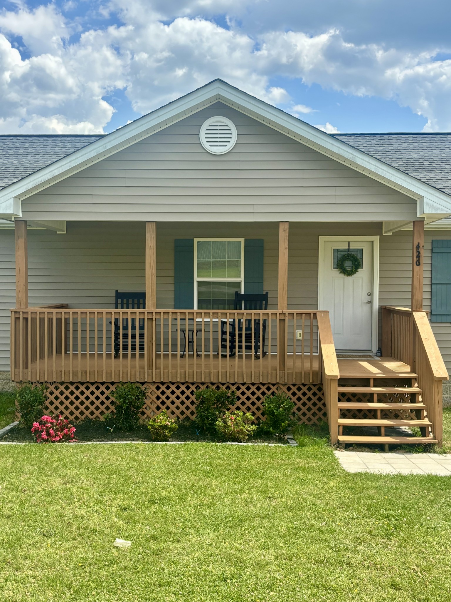 a front view of a house with garden