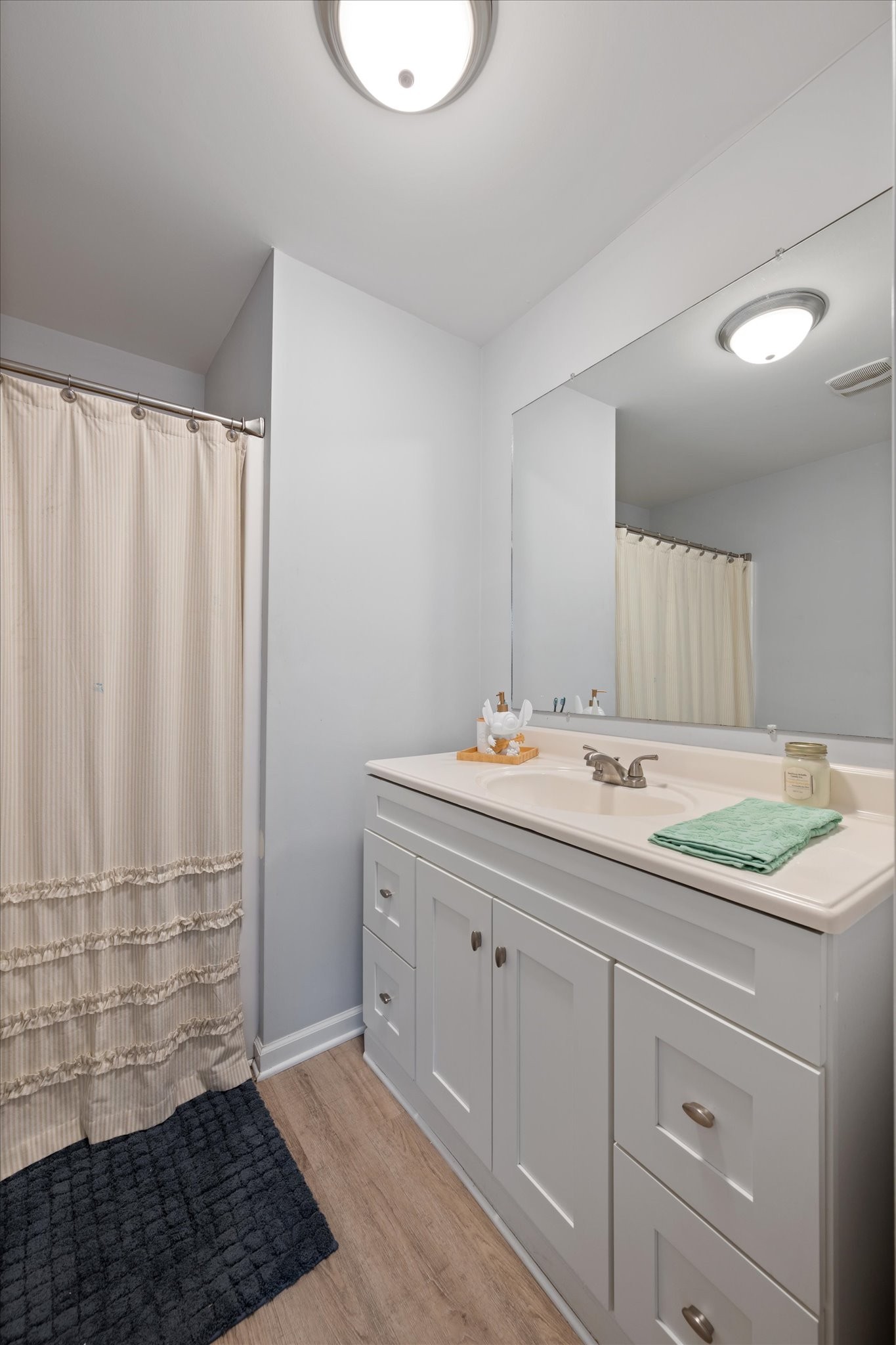 426 Edgewood Street Alexandria, TN 37012 - Photo 12 of 17 a bathroom with a sink and a mirror
