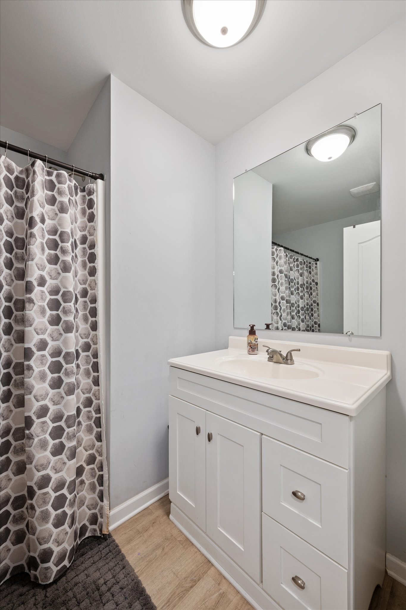 426 Edgewood Street Alexandria, TN 37012 - Photo 14 of 17 a view of bathroom with a sink and a mirror
