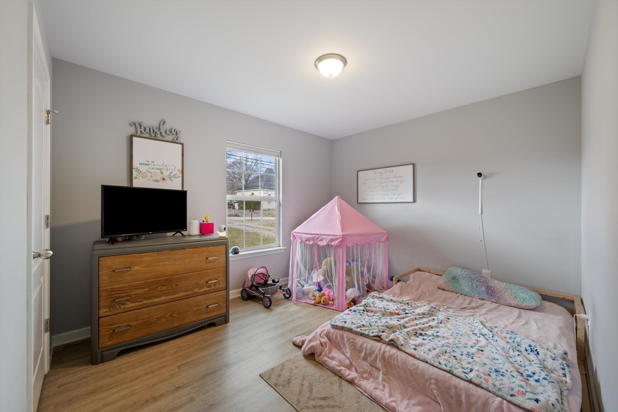 426 Edgewood Street Alexandria, TN 37012 - Photo 15 of 17 a bedroom with a bed and wooden floor