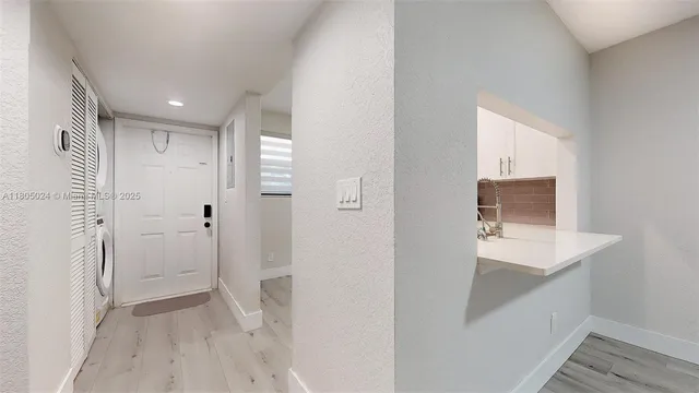 a kitchen with a refrigerator stove and microwave