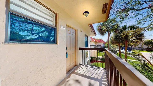a view of a balcony with wooden floor
