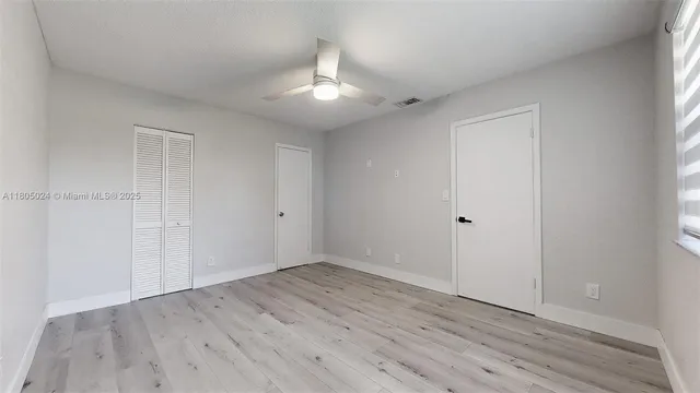 a bathroom with a sink vanity and mirror