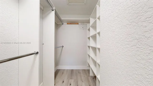 a bathroom with a sink toilet and a mirror